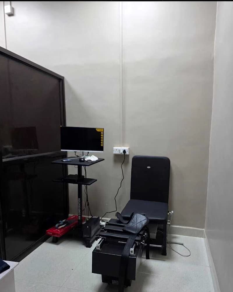Spinal traction and decompression unit in a treatment room at Healwell